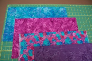 Select four fat quarters of four fabrics for the quilt top. They should be fabrics that go well together, but have some contrast between them.