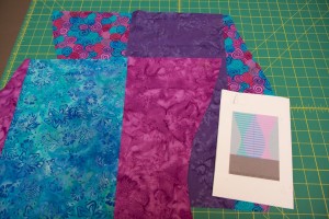 Press all the seams to one side. You should now have two panels that are cut to match the curves in your design. To make it easier to keep track of your panels, place a piece of tape on each panel and label them "1" and "2."