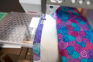 Using a 1/4-in foot sew along the top edge of your strips. A foot with a 1/4-in guide can make this easier. You may prefer to use a walking foot,