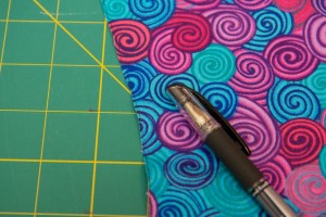 Using your dark pen, draw a line down the left edge of the front side of each panel. Remember "the Line is on the Left" so that you know how to orient your panels and strips when you sew them together.