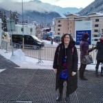 Lorrie with boots and long coat at transportation hub, WEF 2016